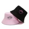Bob-réversible-smiley-face-rose-et-face-noire-sur-fond-blanc